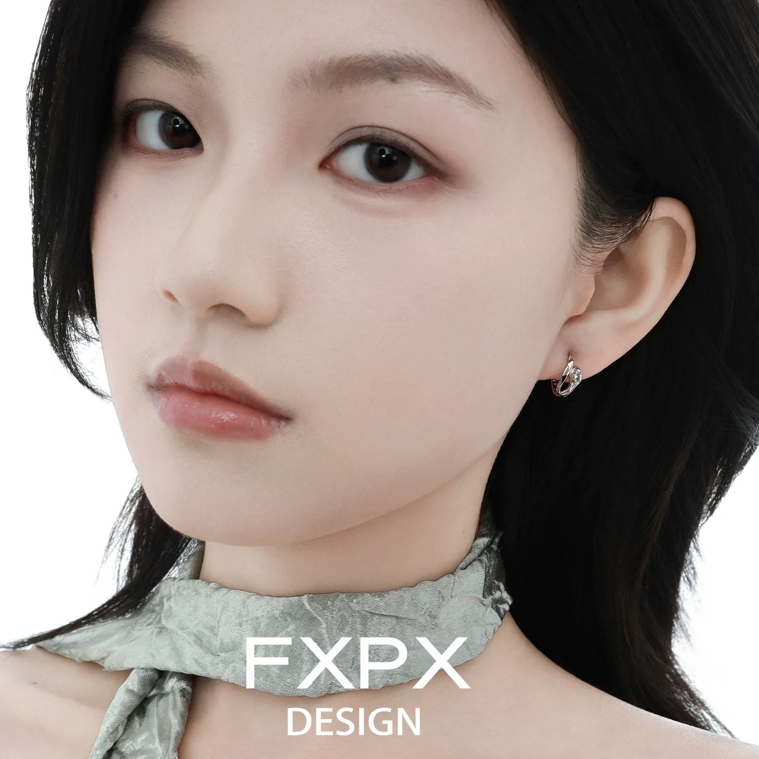 Elegant blue and white serpentine zircon earrings showcased on a model's ear for a stylish look