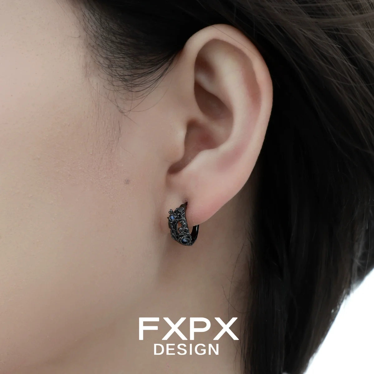FXPX blue black rose stud earrings showcased in a model's ear for elegant styling