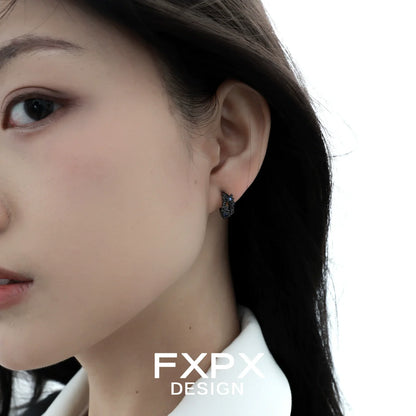 Elegant blue black rose stud earrings showcased on a model, perfect for stylish accessories.