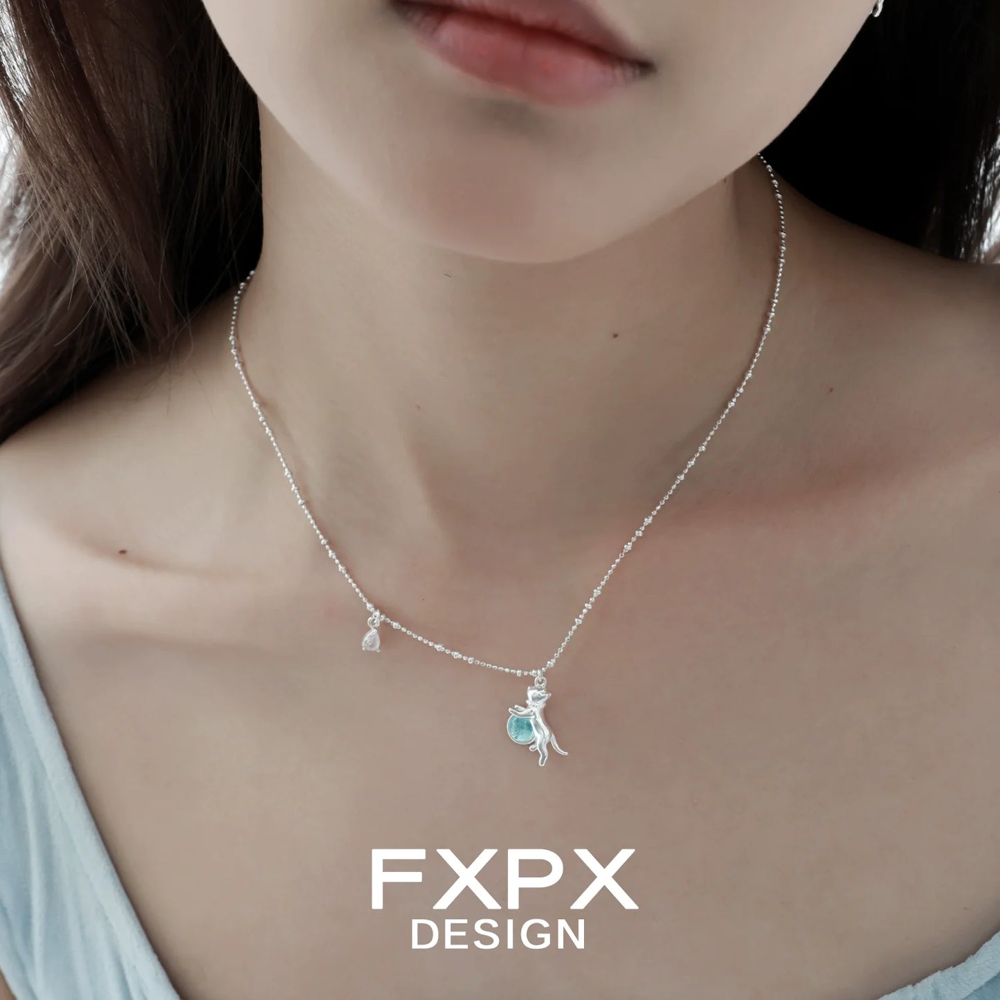 Silver chain with blue cat pendant necklace for a stylish and playful look