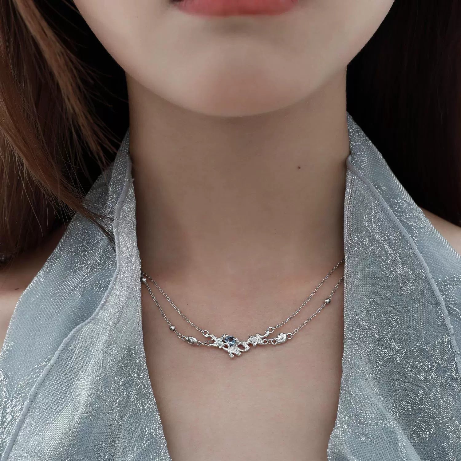 Elegant blue crystal necklace crafted with delicate silver accents for a stunning look