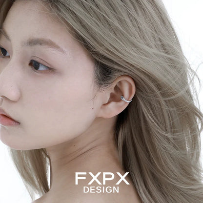 Stylish FXPX blue snake ear cuff on a model's ear for a unique accessory look