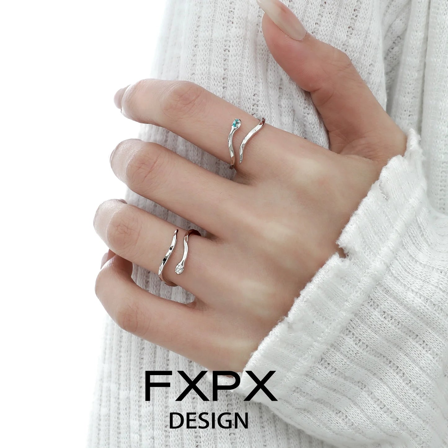Elegant blue white snake ring by FXPX with intricate design and sparkling details