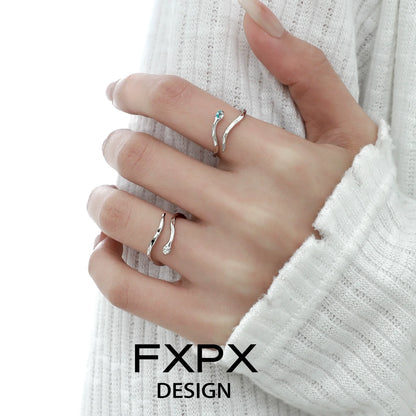 Elegant blue white snake ring by FXPX with intricate design and sparkling details