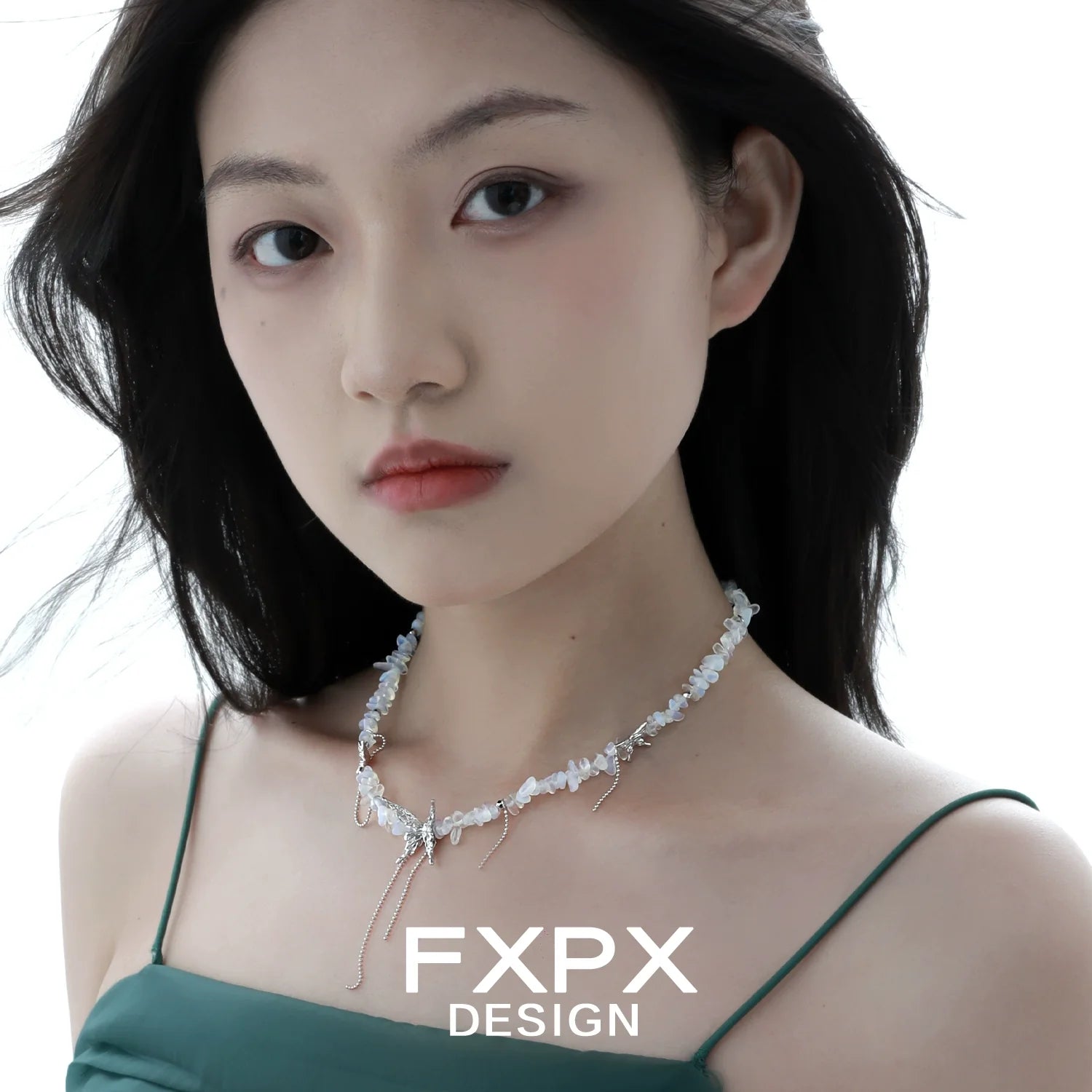 Elegant FXPX butterfly beaded necklace with a delicate design and light blue accents