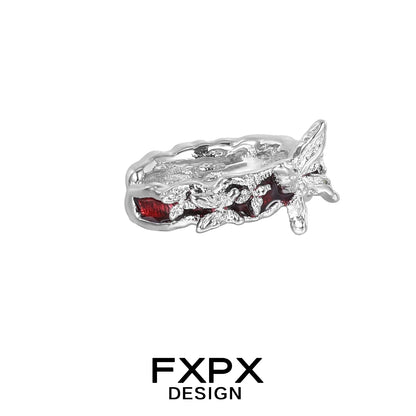 Silver FXPX butterfly ear cuffs with intricate design and sparkling red accents