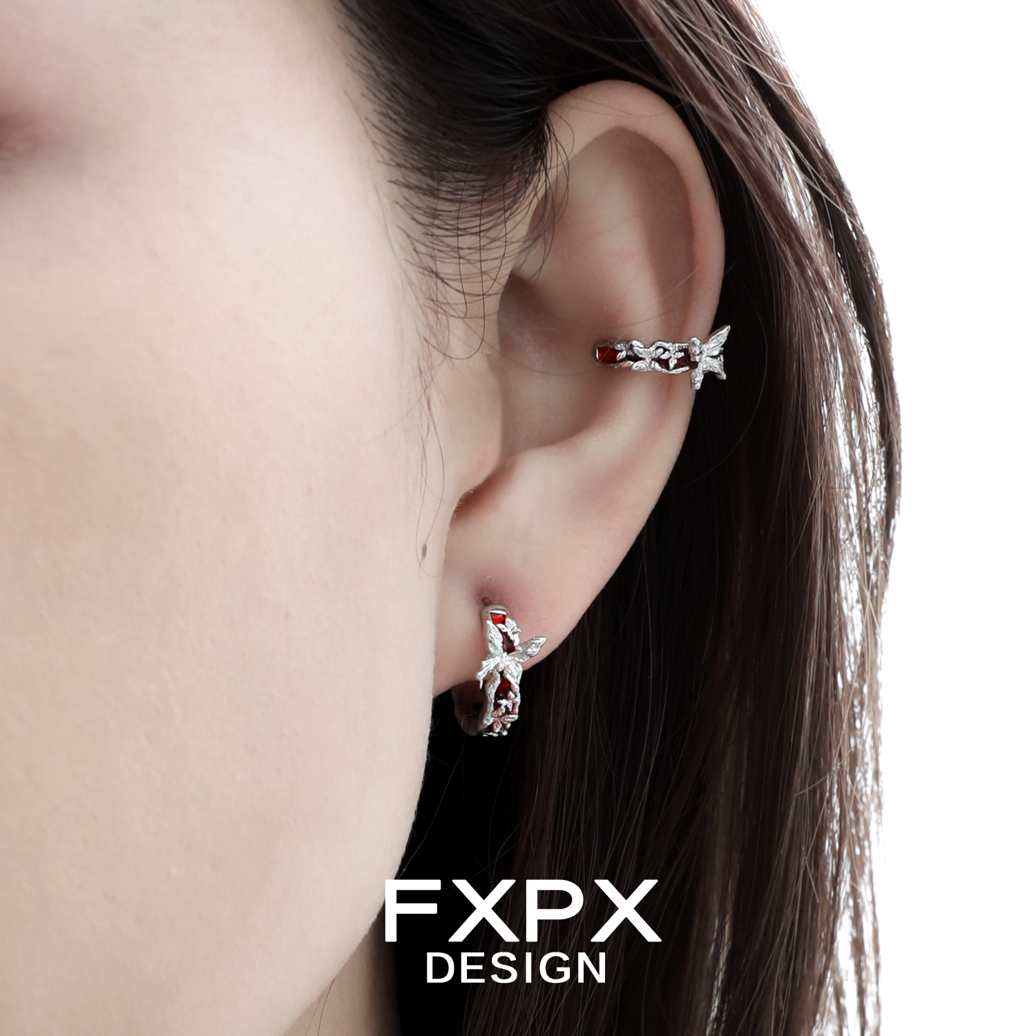 Silver FXPX butterfly ear cuffs showcased on an ear for a stylish and trendy look
