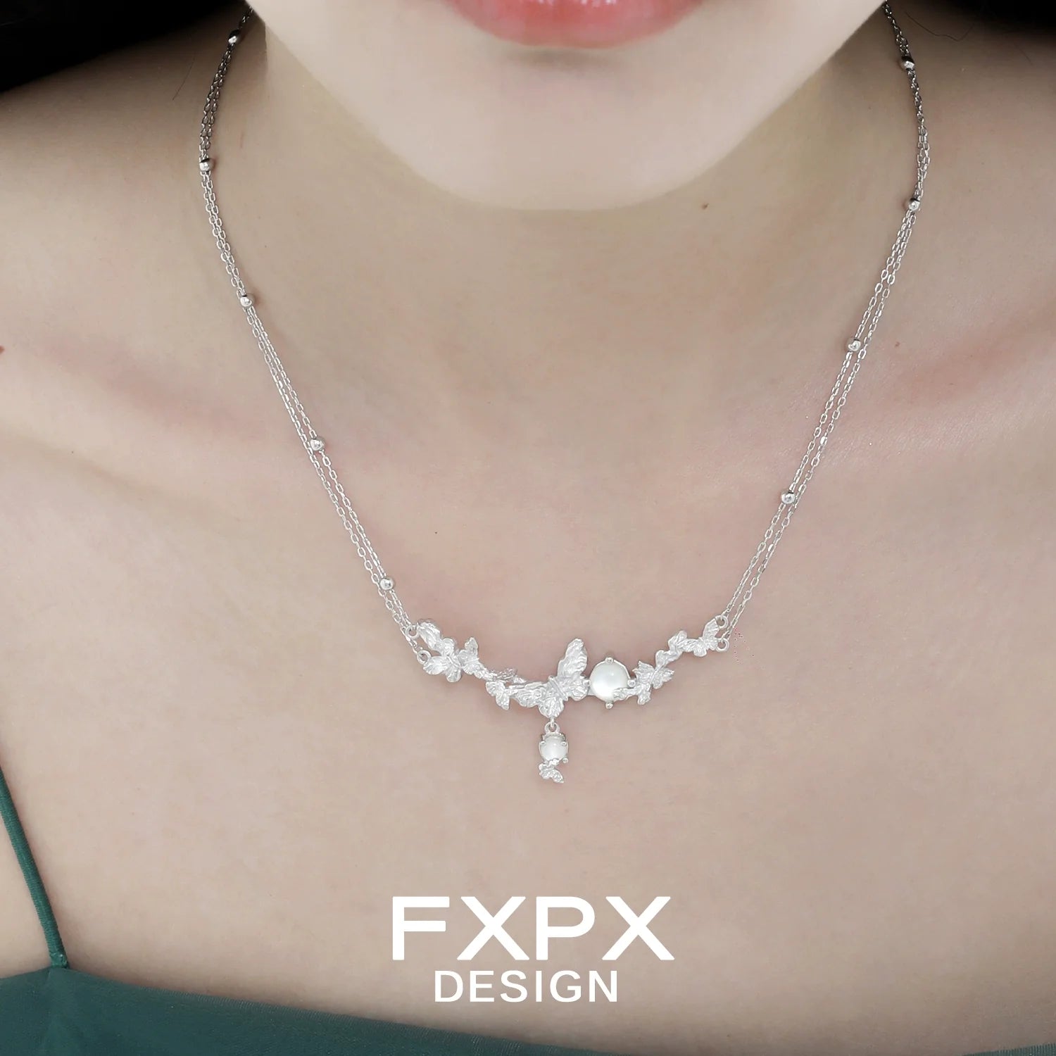 Elegant FXPX butterfly necklace for women featuring a delicate floral design and shimmering details