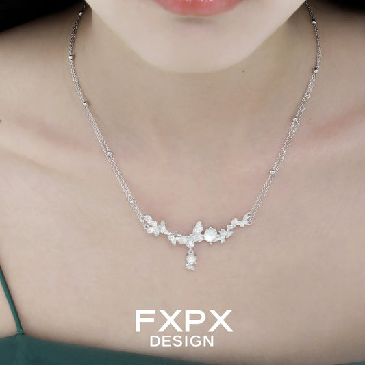 Elegant FXPX butterfly necklace for women featuring a delicate floral design and shimmering details