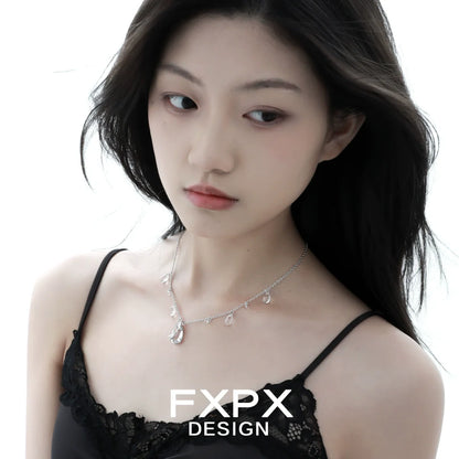 Butterfly water drop silver necklace elegantly worn by a model with a simple black top