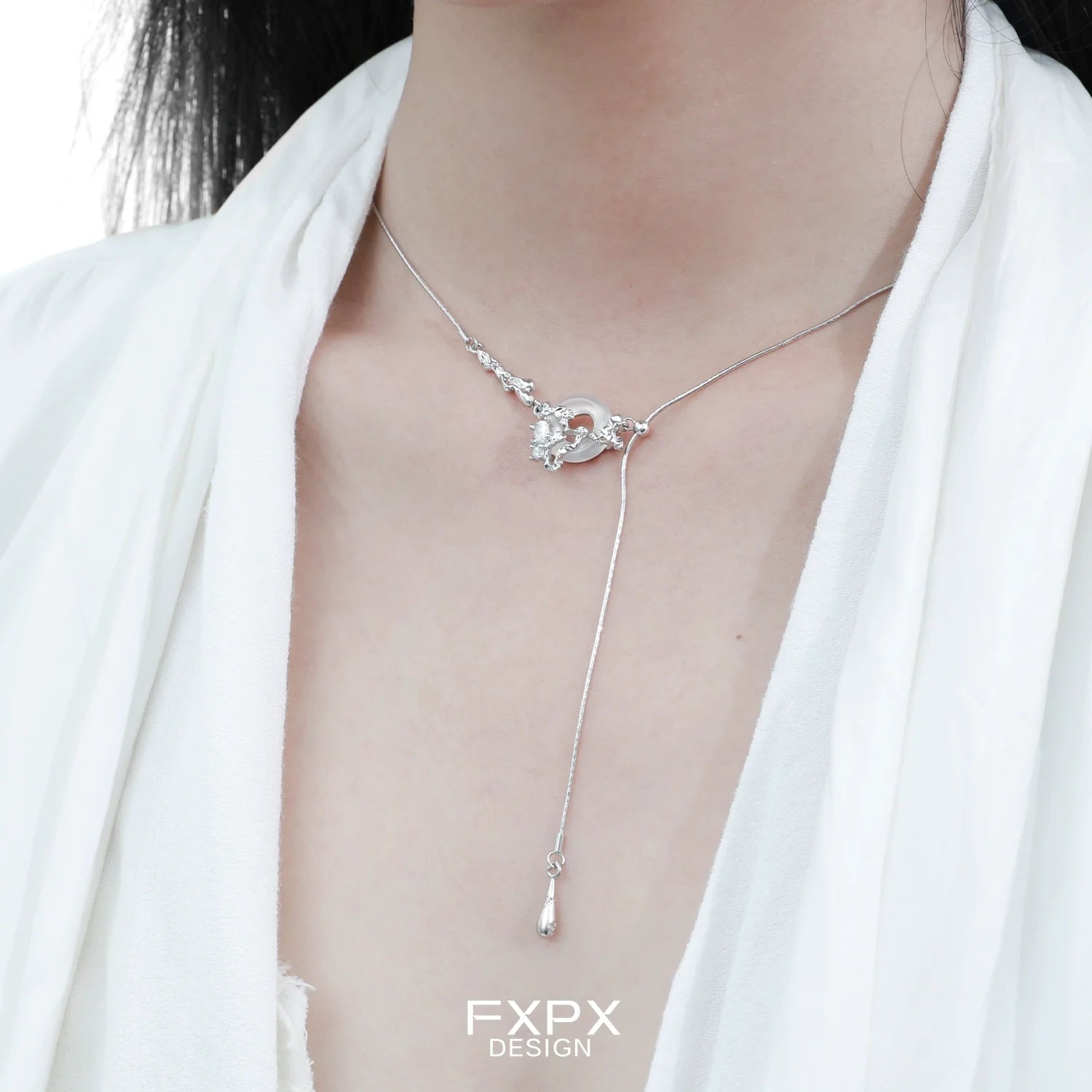 Elegant celestial eclipse agate necklace with a delicate silver chain and unique pendant design