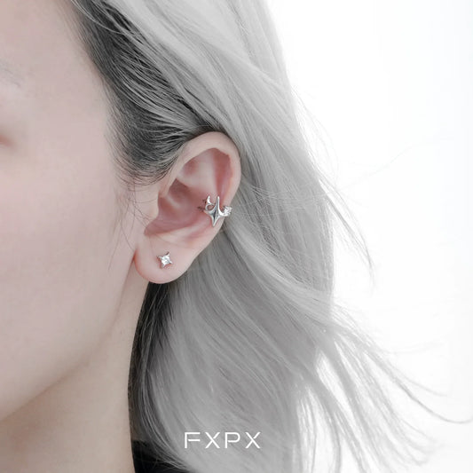 FXPX celestial star ear cuffs displayed on a model's ear showcasing a stylish design
