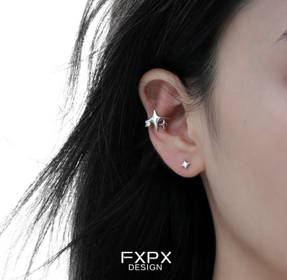 Silver FXPX celestial star ear cuffs worn on the ear, featuring a star and a sparkling design