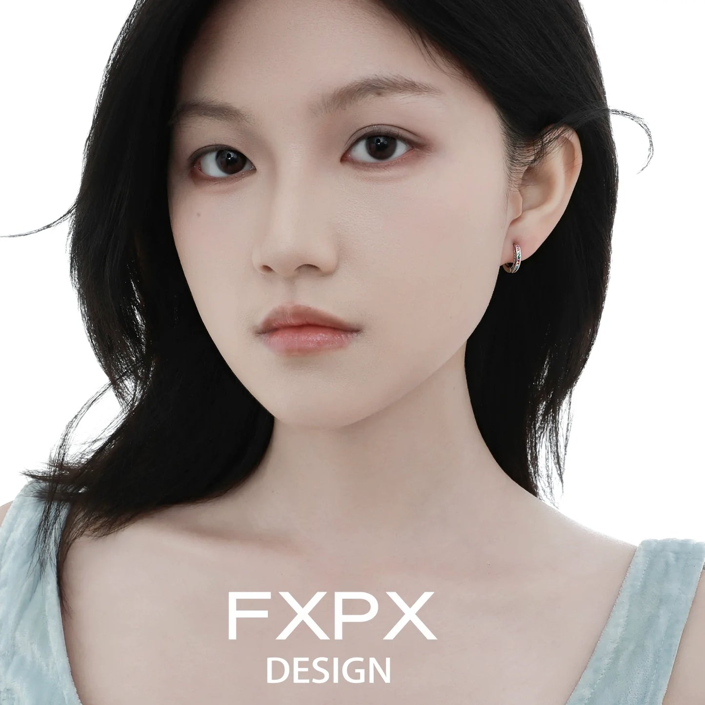 Elegant model wearing FXPX colorful zircon earrings, showcasing vibrant and sparkling designs