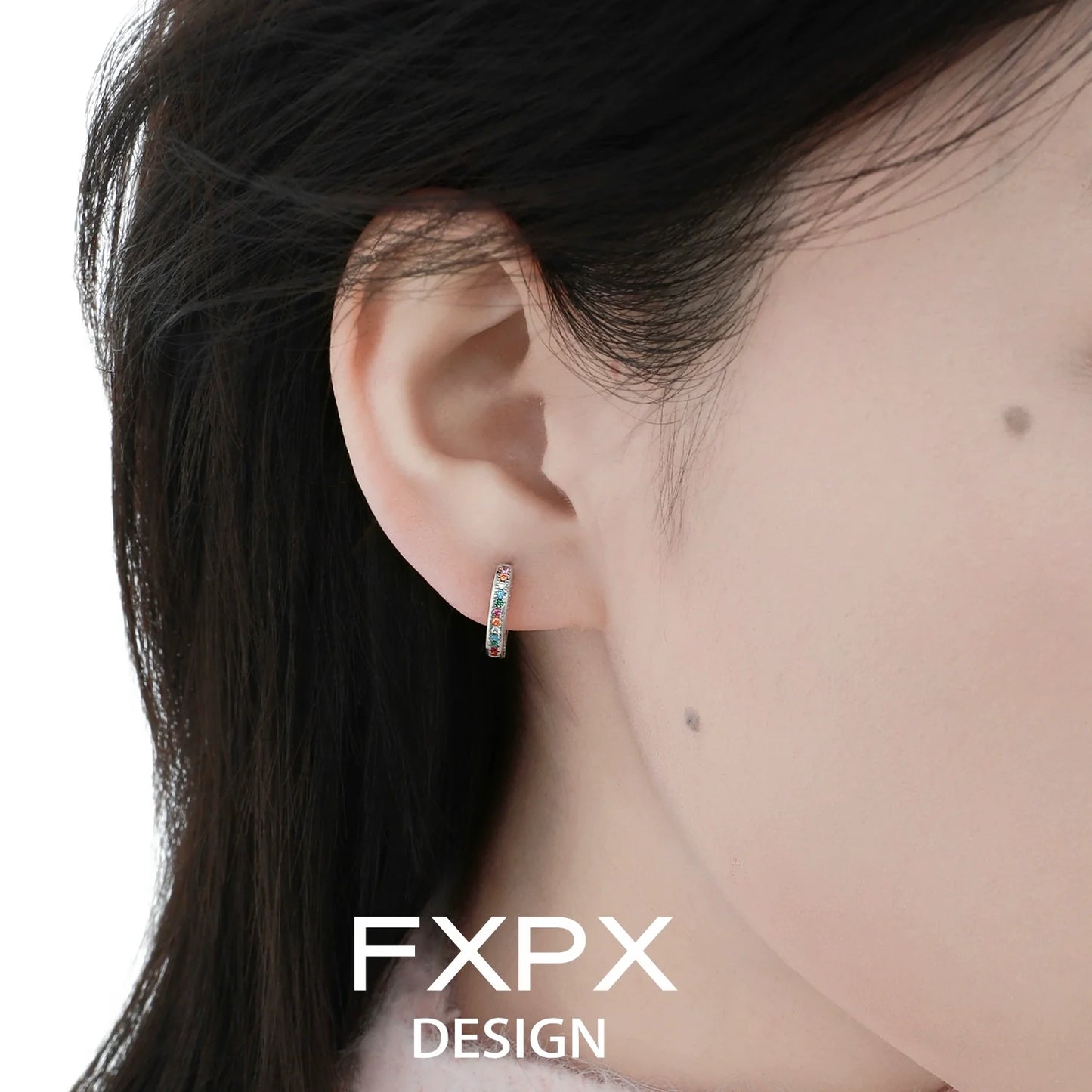 Stylish FXPX colorful zircon earrings displayed on a model's ear for elegant accessorizing