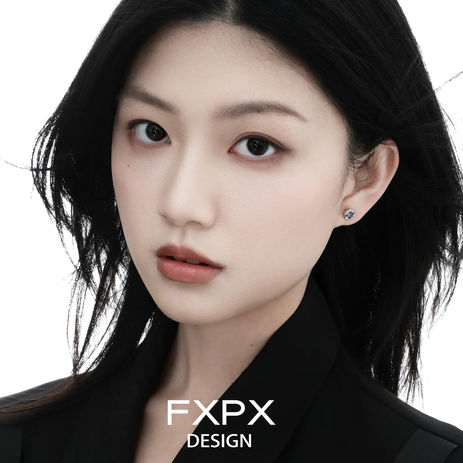Elegant woman wearing colorful zircon stud earrings that add a vibrant touch to her look