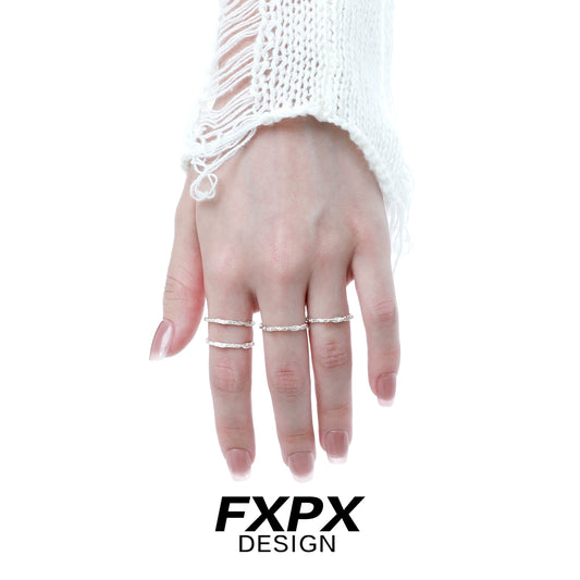 Minimalist textured thin ring on a model's hand, showcasing an elegant and simple design