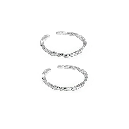 Two FXPX minimalist textured thin rings with a unique design in a silver finish