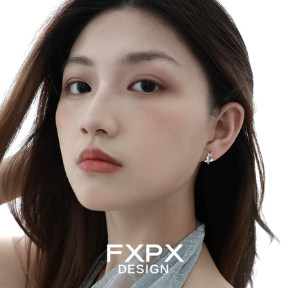 Elegant mirror butterfly silver earrings showcased on a model's ear with soft lighting