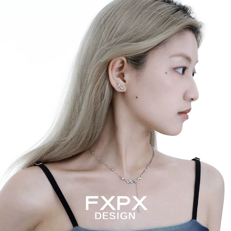 Elegant FXPX mystic mermaid earrings showcased on a model for a stylish look