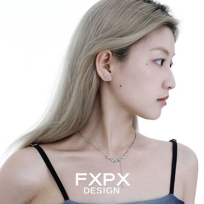 Elegant FXPX mystic mermaid earrings showcased on a model for a stylish look