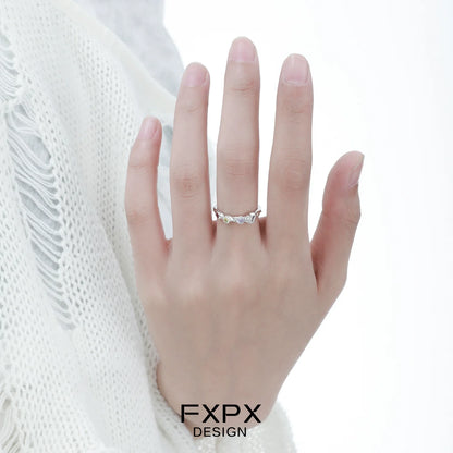 Elegant FXPX dopamine colored zircon ring showcased on a hand with a delicate design