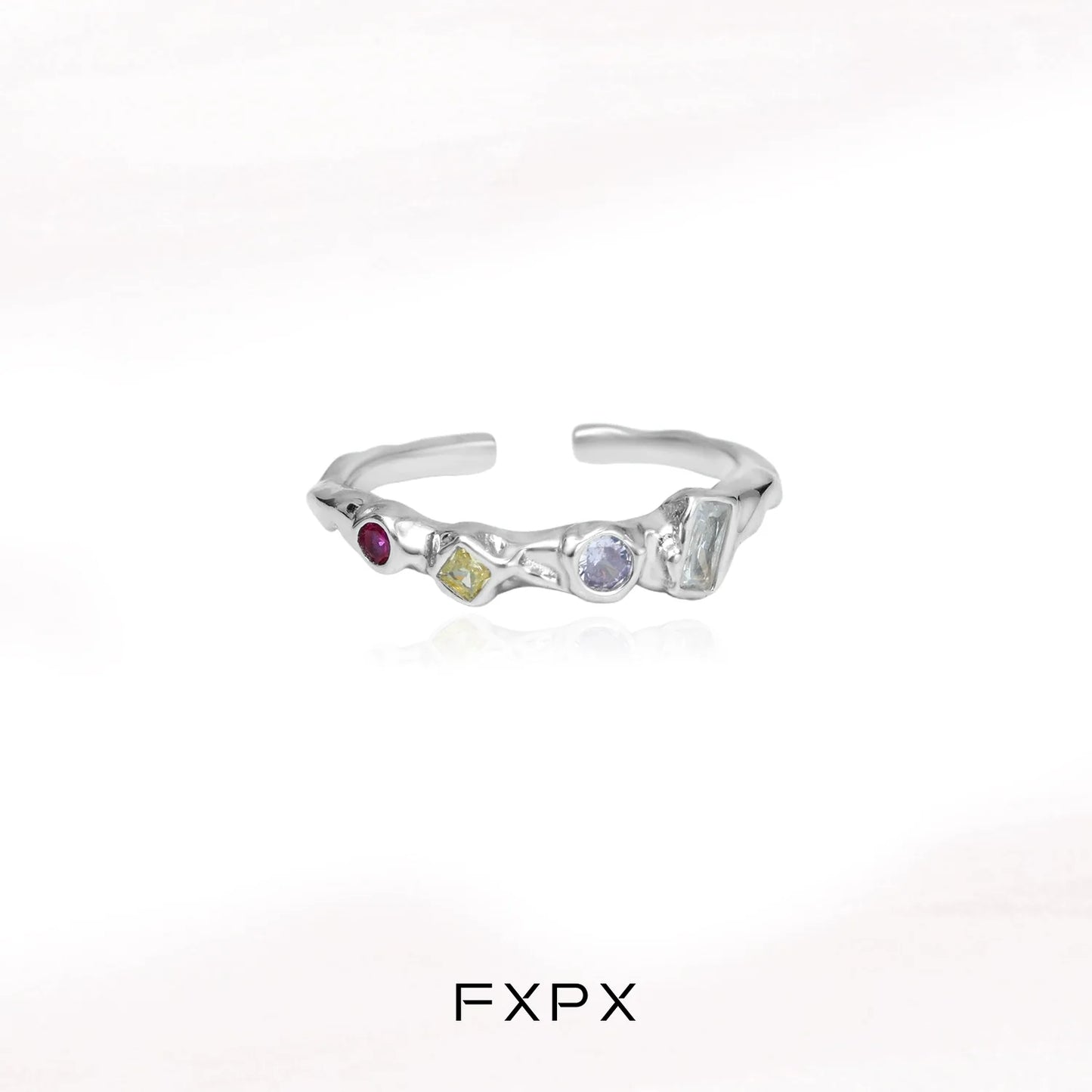 FXPX dopamine colored zircon ring with unique gemstone arrangement and modern design