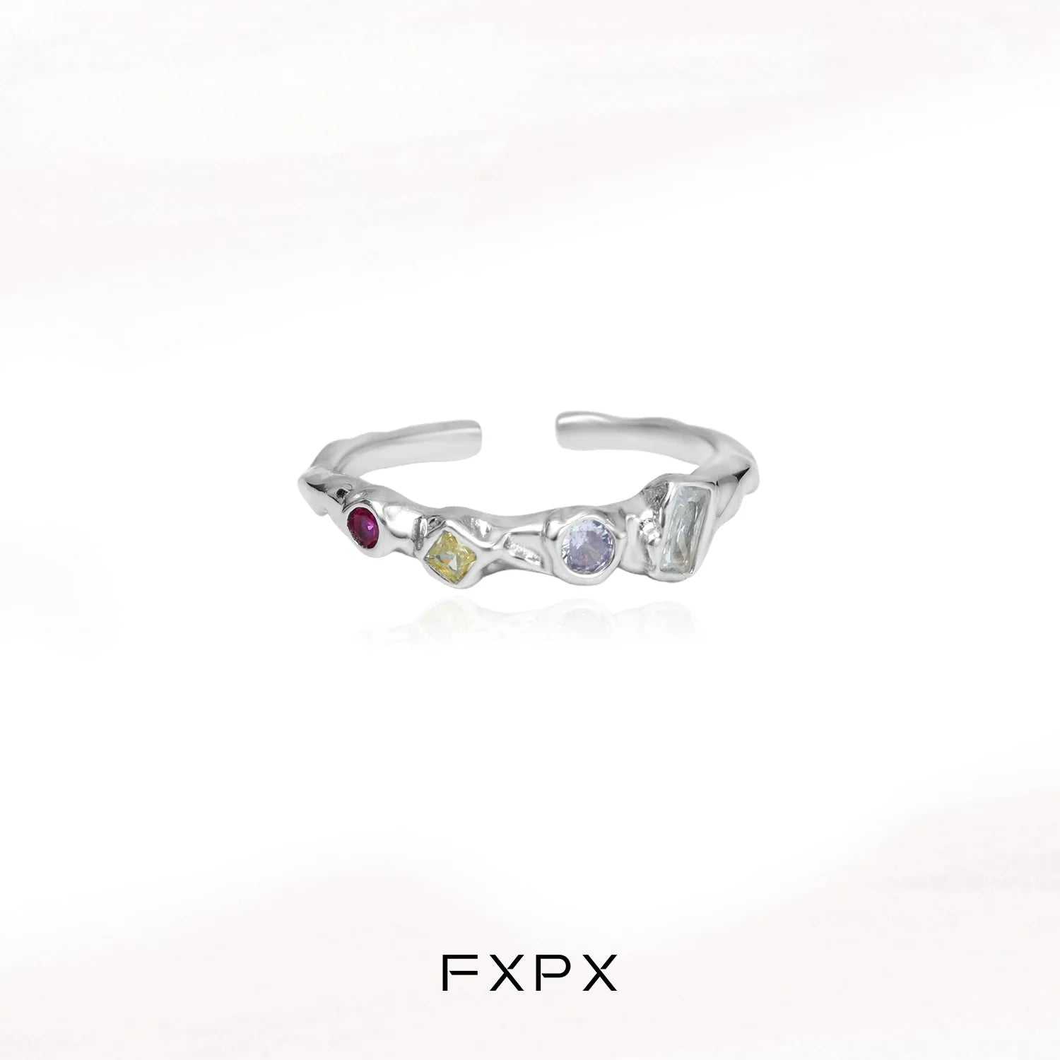 FXPX dopamine colored zircon ring with unique gemstone arrangement and modern design