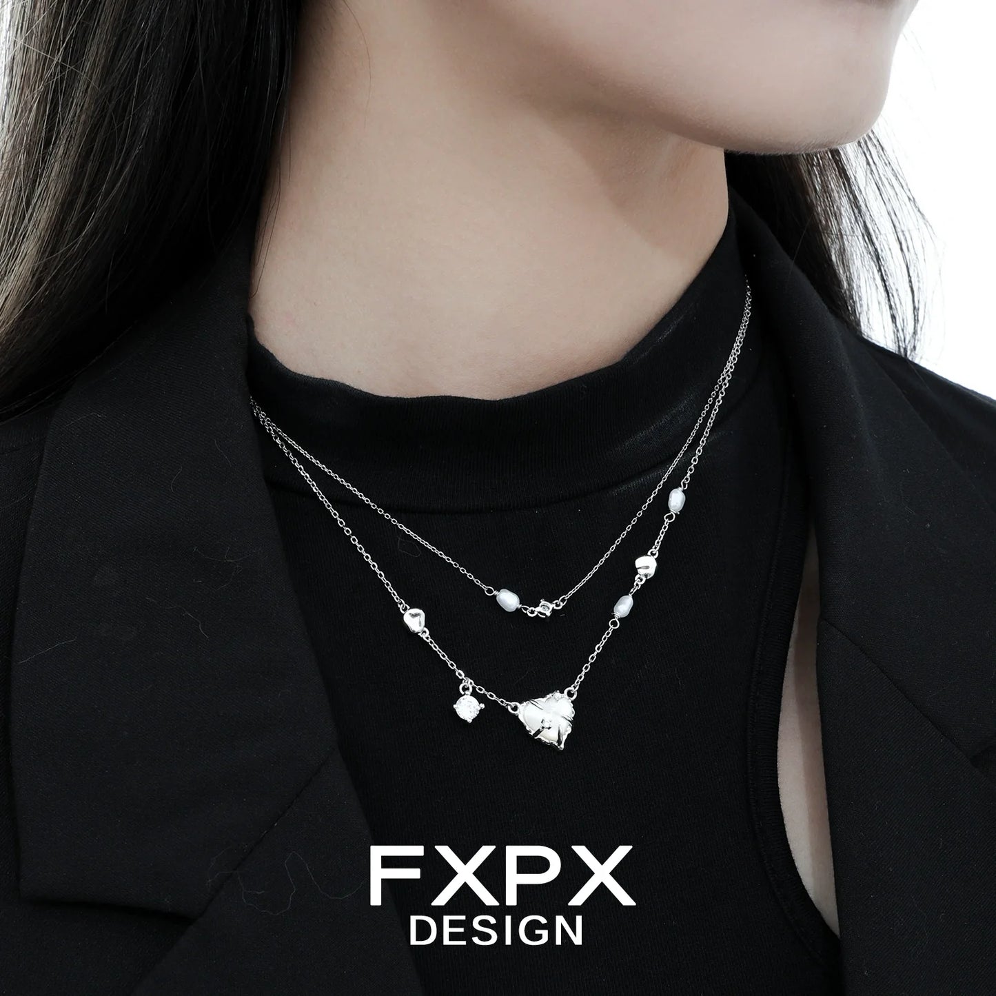 Double layer silver love necklace with delicate charms, featuring an elegant design for everyday wear