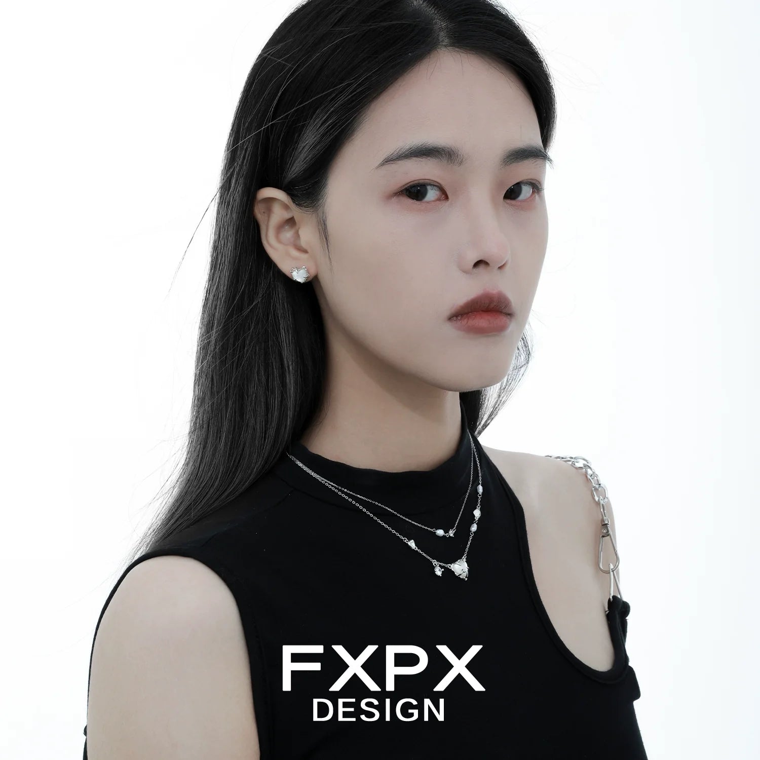 Model wearing a double layer silver love necklace showcasing elegant design and style