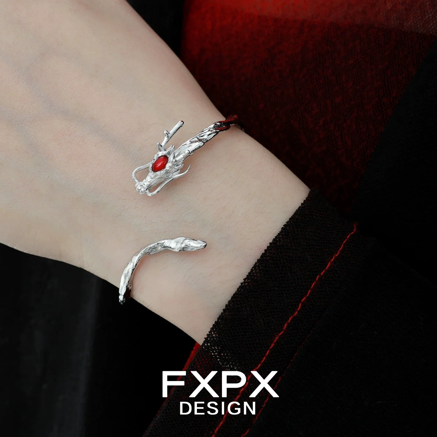 FXPX dragon guardian silver bracelet with intricate design and red gemstone accent