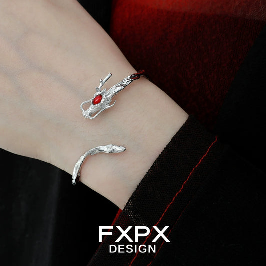 FXPX dragon guardian silver bracelet with intricate design and red gemstone accent