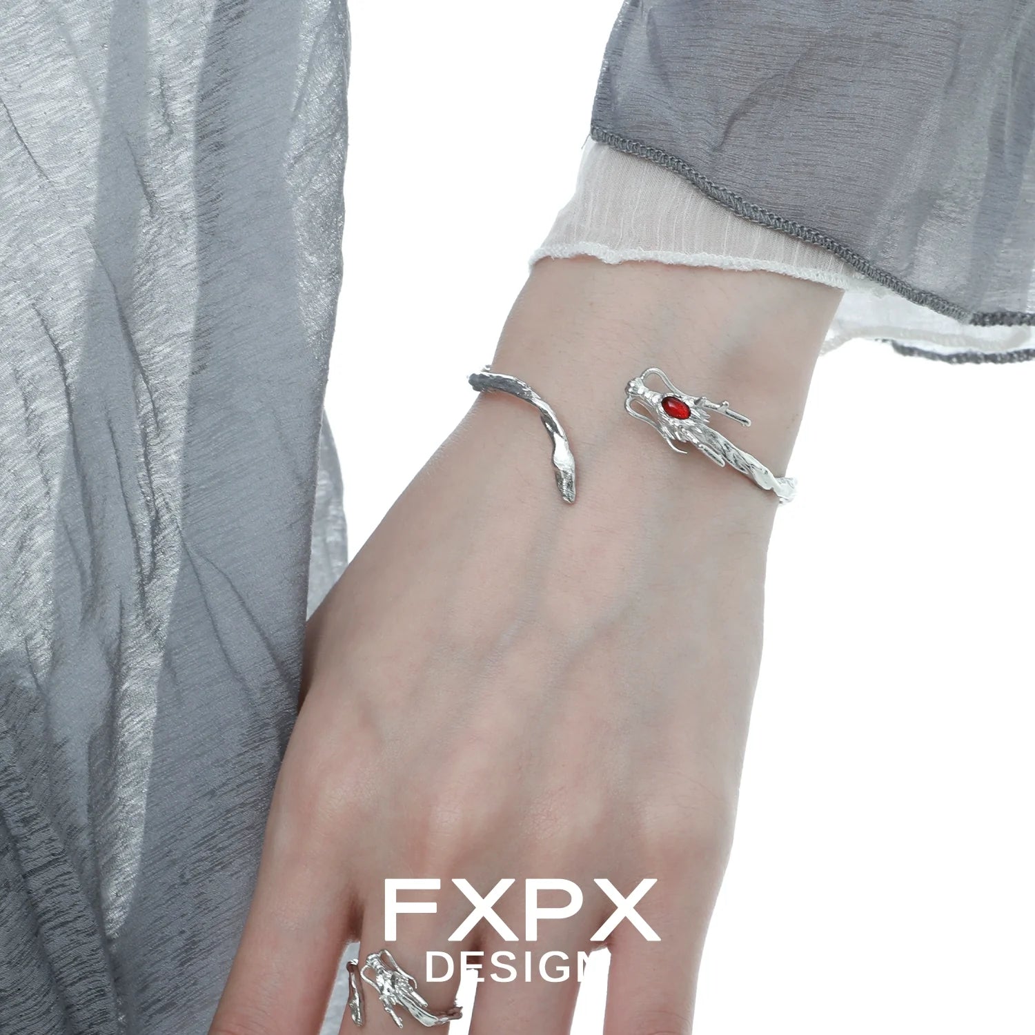 FXPX dragon guardian silver bracelet featuring intricate design and red gemstone accent
