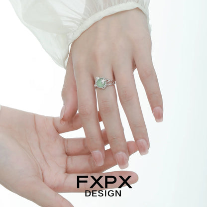 Elegant FXPX eagle claw gemstone ring set on a model's hand, showcasing its unique design