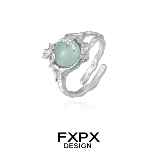 FXPX eagle claw gemstone ring with a unique design featuring a large green gemstone