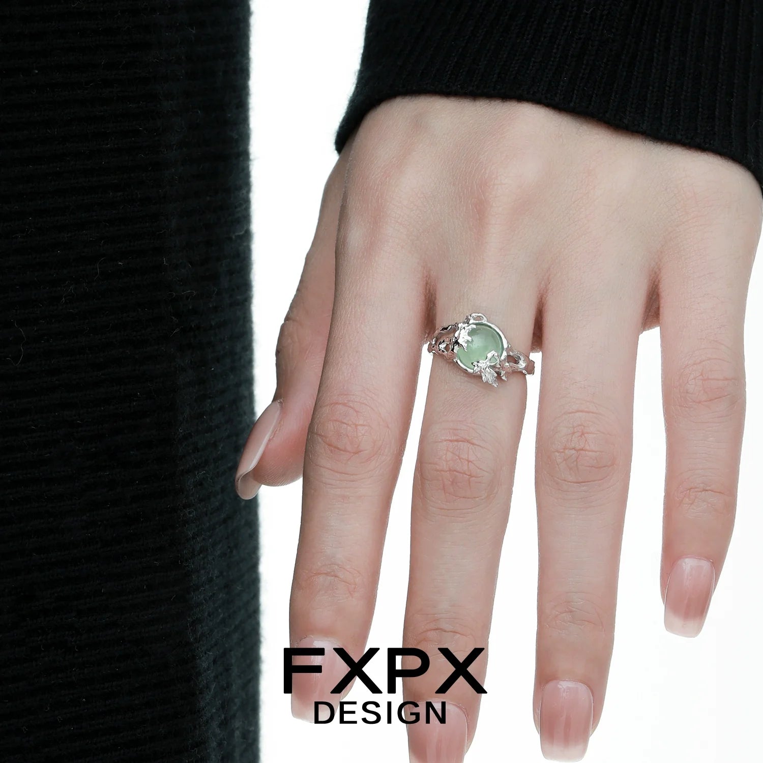 Elegant FXPX eagle claw gemstone ring set with a beautiful green stone for a unique look