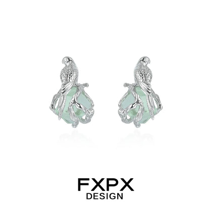 Silver FXPX flying bird fluorite earrings with detailed bird design and elegant gemstone setting