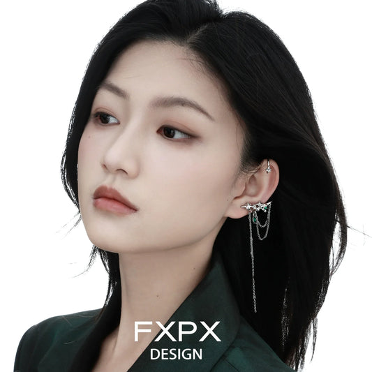 Elegant model wearing FXPX forest star ear cuff with delicate chain detail for a stylish look