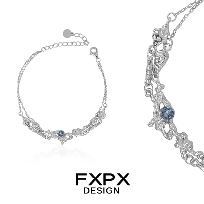 FXPX frost blue zircon bracelet featuring intricate silver detailing and elegant design