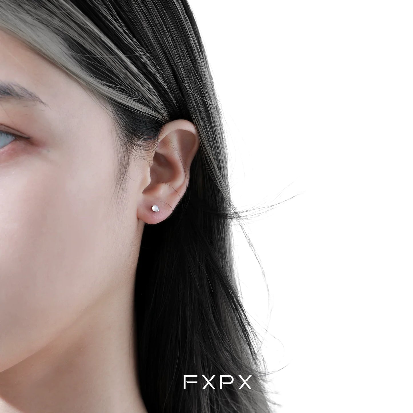 Beautiful frosted white agate stud earrings showcased on a model's ear for elegant style