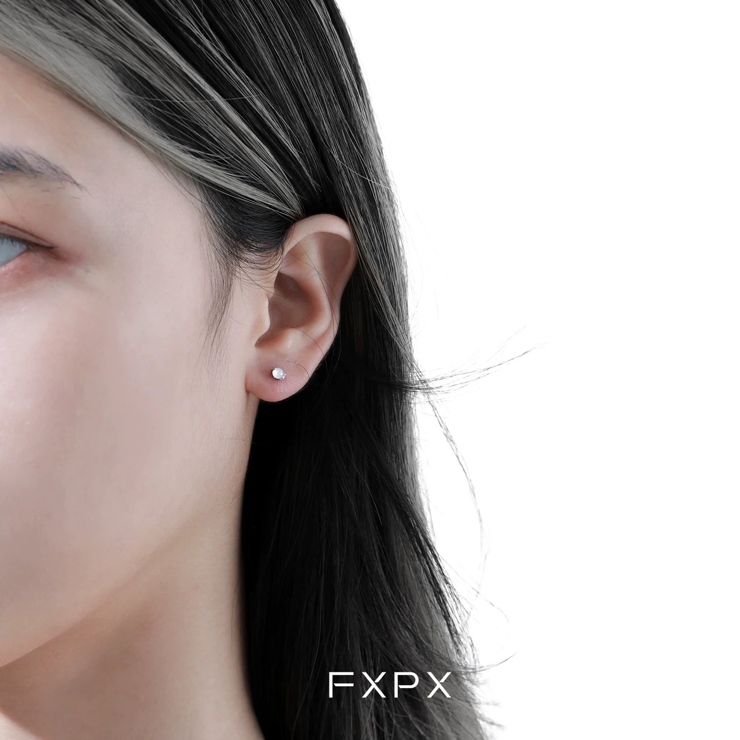 Beautiful frosted white agate stud earrings showcased on a model's ear for elegant style