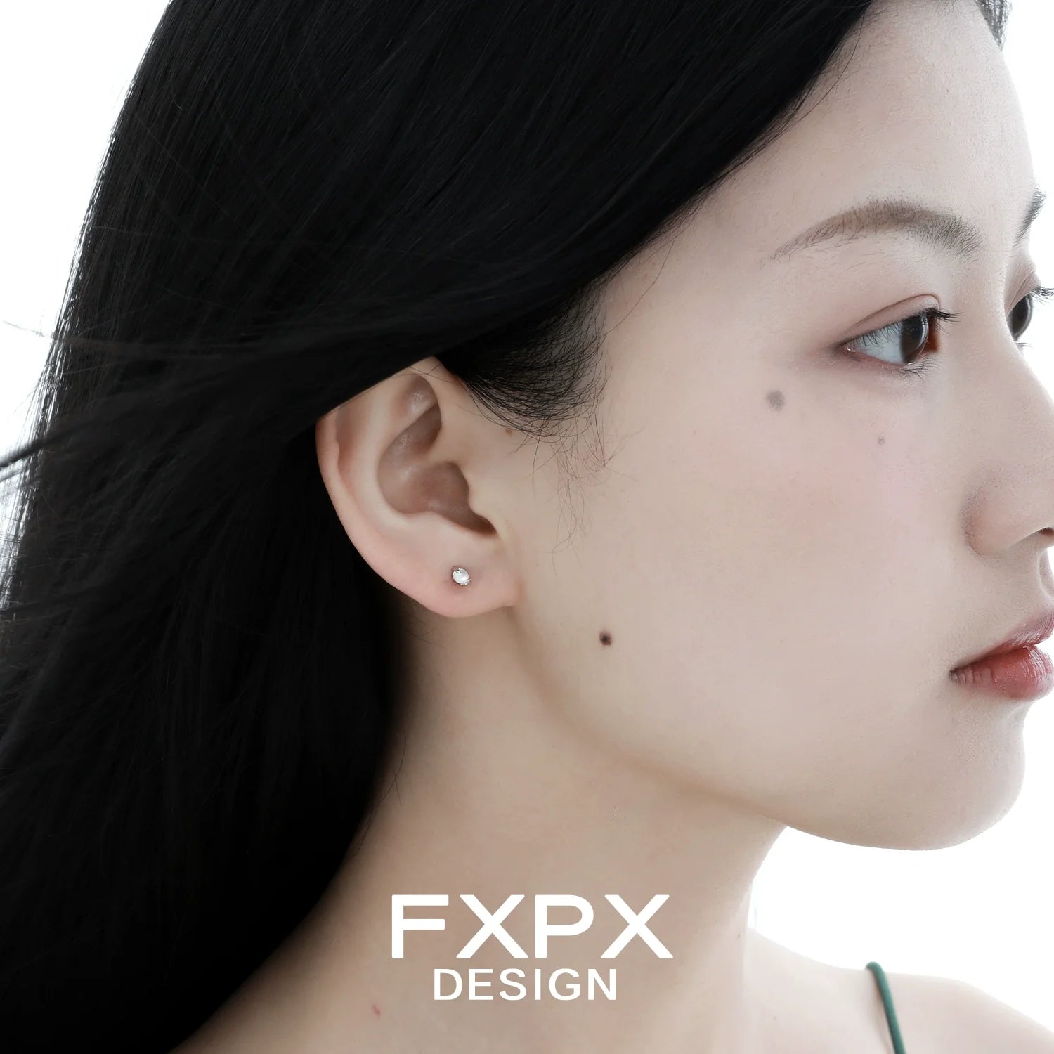 Elegant frosted white agate stud earrings showcased on model's ear for a stylish look