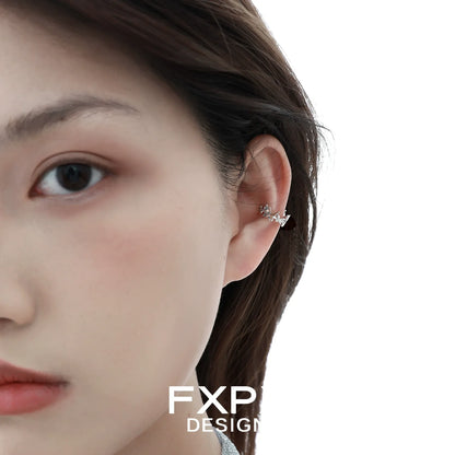 Stylish futuristic butterfly ear cuff worn on the ear for a unique fashion statement