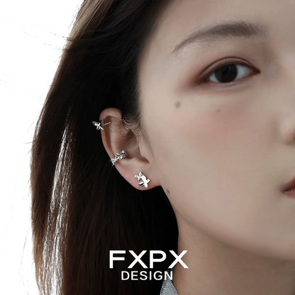 Stylish FXPX futuristic butterfly ear cuff design worn on a model's ear for a trendy look