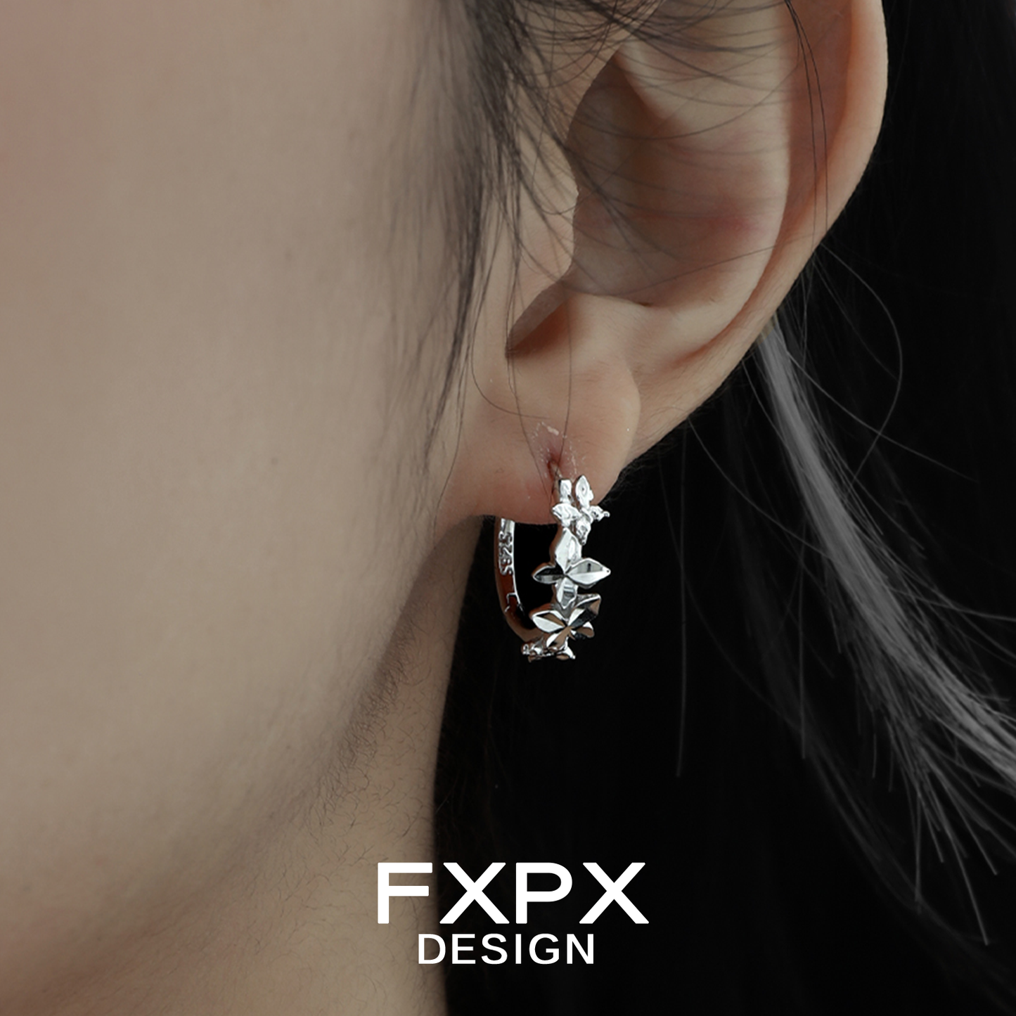 Futuristic butterfly earrings in silver with a modern design, perfect for stylish outfits