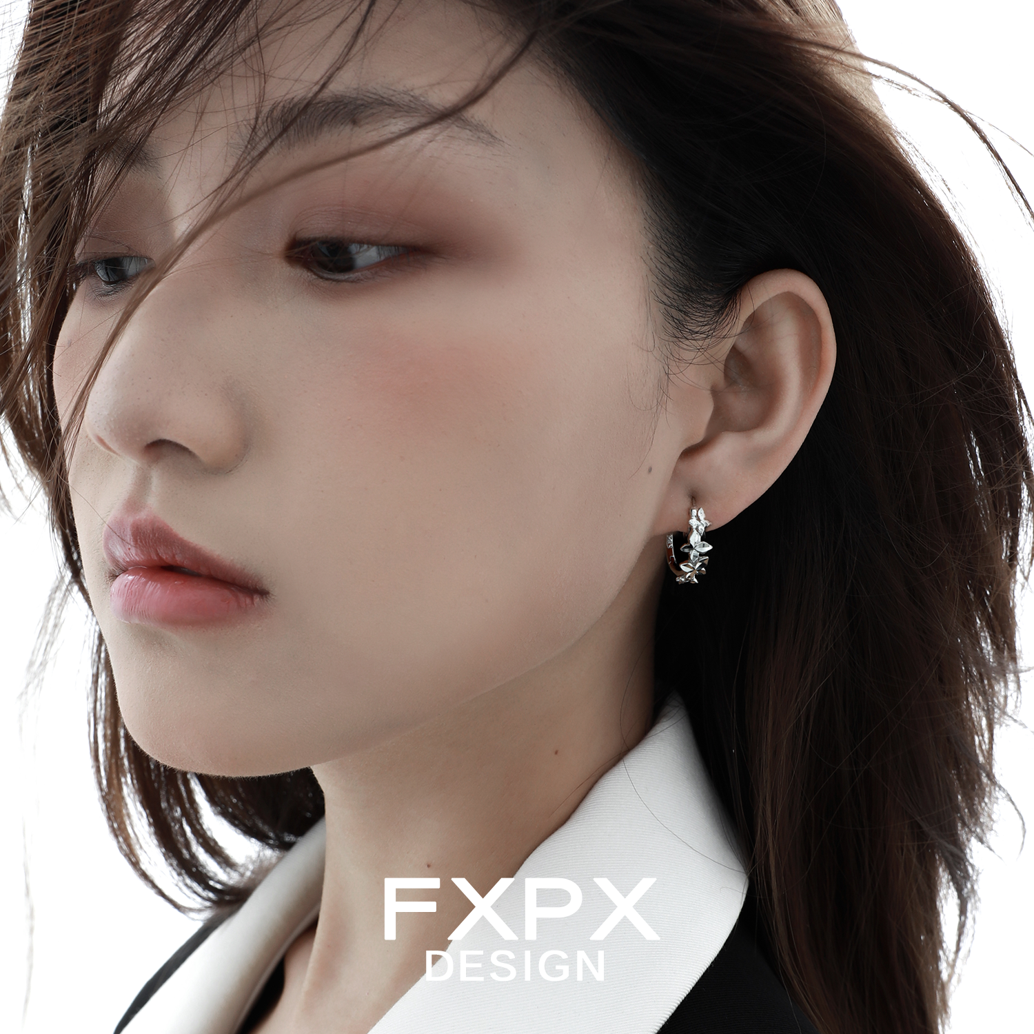 Elegant futuristic butterfly earrings designed by FXPX, adding a modern touch to any outfit