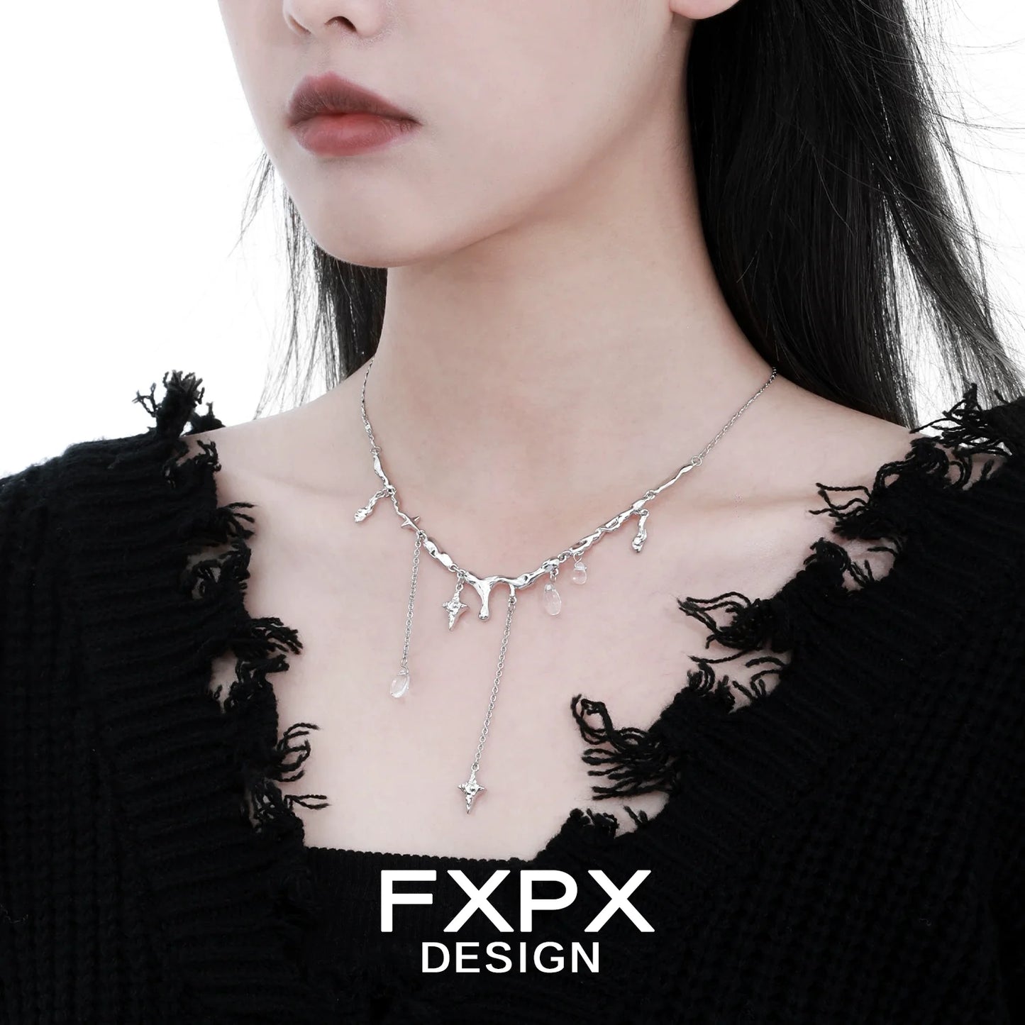 Stylish FXPX galactic meteor tassel necklace on a model with a chic black sweater