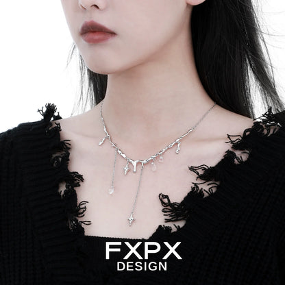 Stylish FXPX galactic meteor tassel necklace on a model with a chic black sweater
