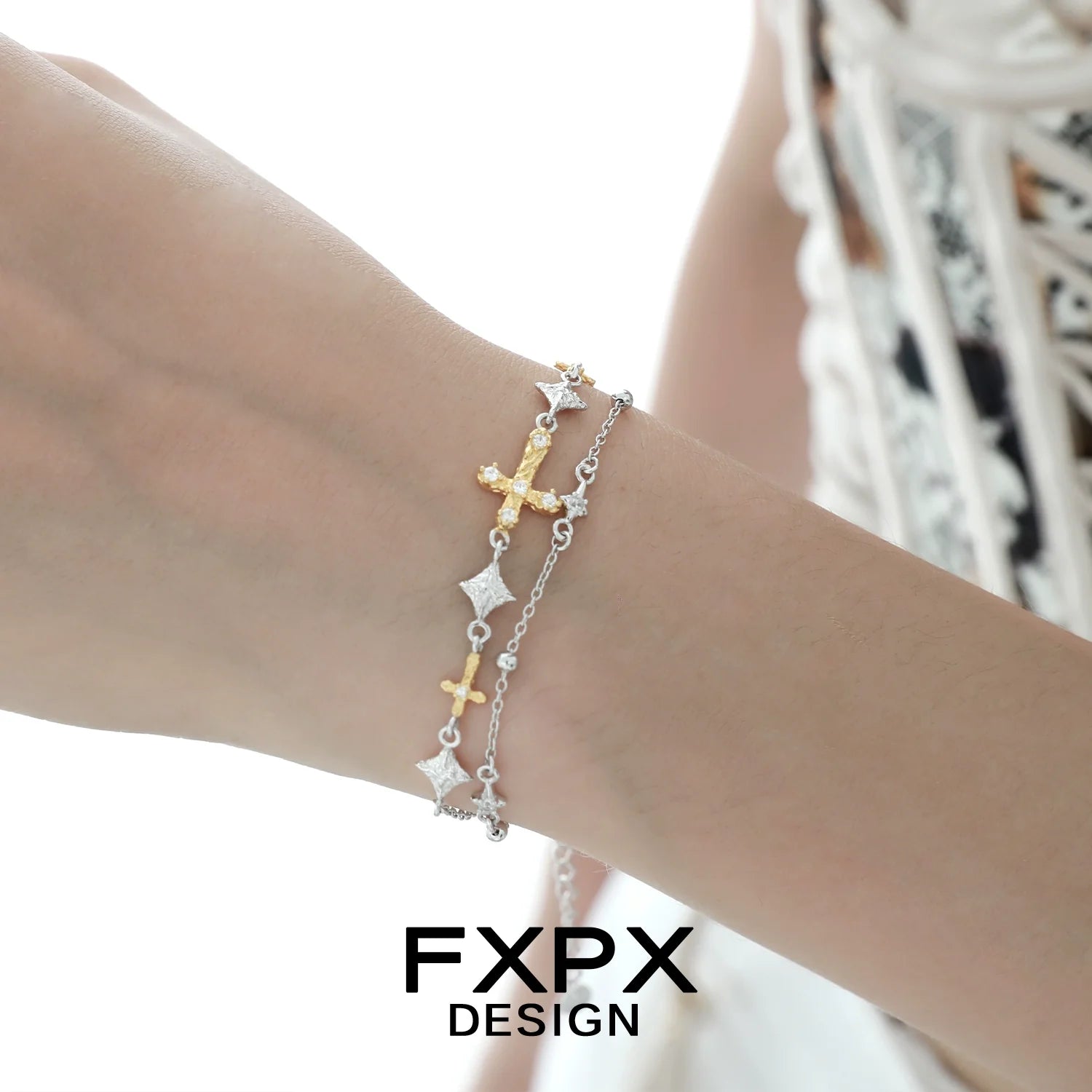 Elegant gold cross silver bracelet with delicate charms and adjustable length for stylish accessorizing