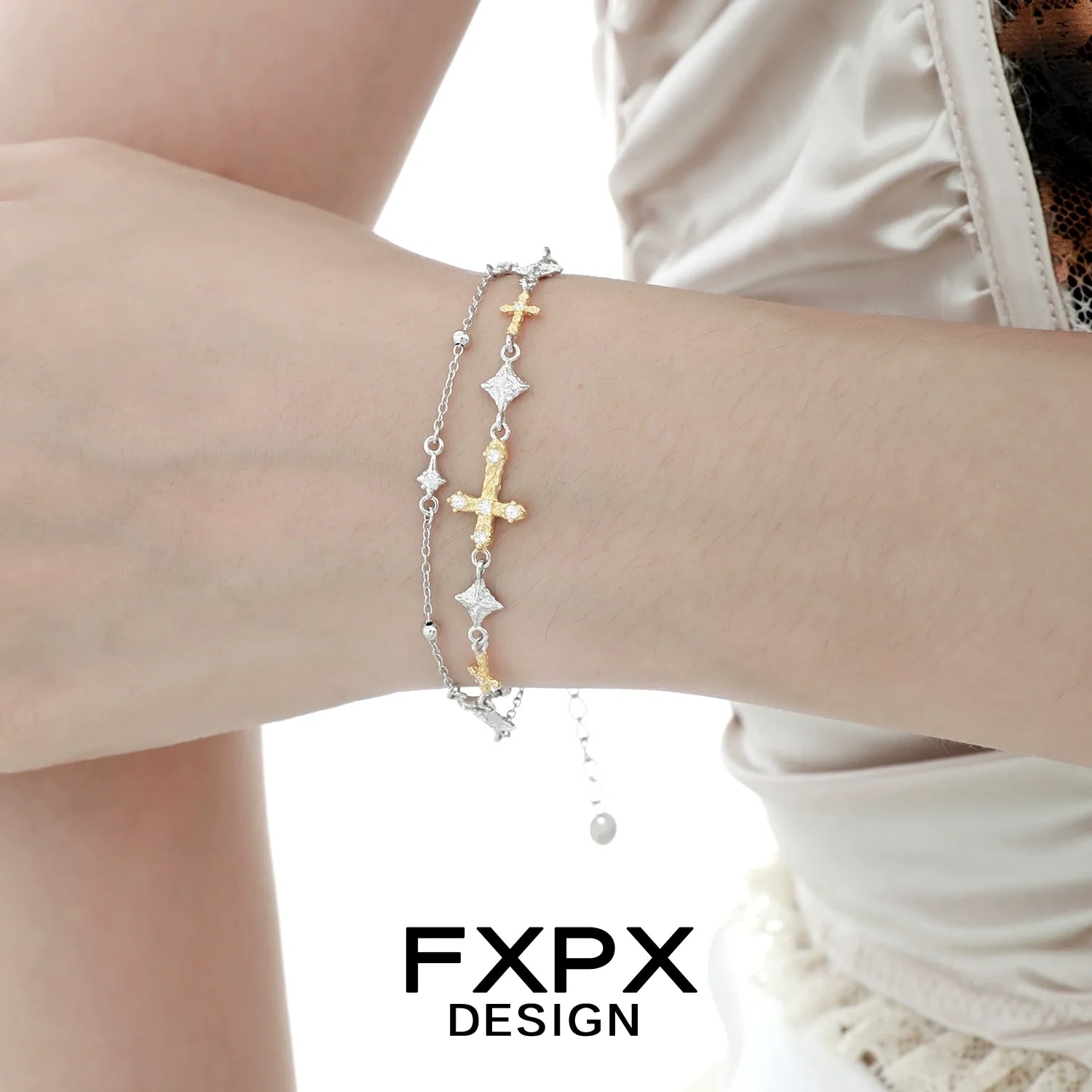 Gold cross silver bracelet featuring multiple crosses on a delicate chain for stylish layering